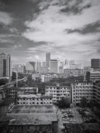 High angle view of buildings in city against sky