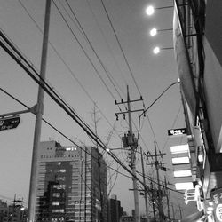 Low angle view of electricity pylon against sky