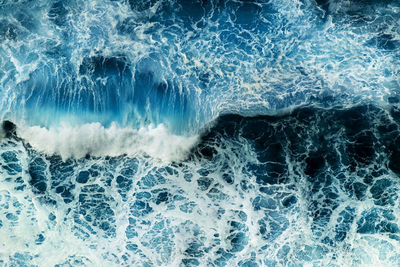 High angle view of splashing sea wave