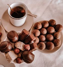 High angle view of coffee and cups on table