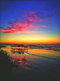 Scenic view of sea against romantic sky at sunset