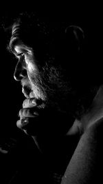 Portrait of man in black background