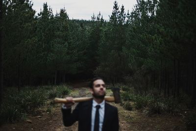 Portrait of young man in forest