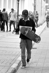 Young boy skating on the road in the city