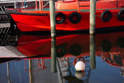 Boats moored in lake