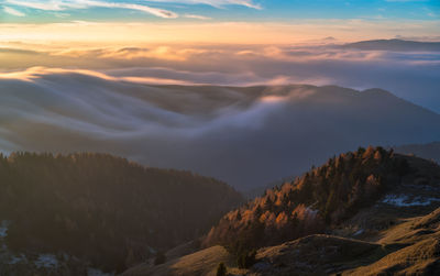 Scenic view of mountains against sky during sunset