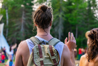 Rear view of couple holding hands