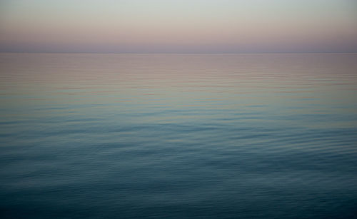 Scenic view of sea against sky at sunset