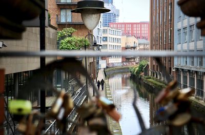 Reflection of buildings on street in city