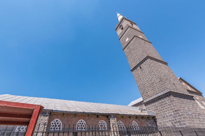 Low angle view of traditional building against clear blue sky