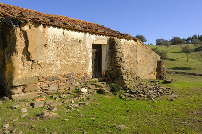 Abandoned building against clear sky