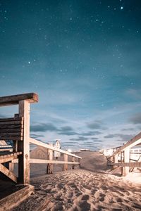 Scenic view of beach against sky at night