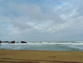 Scenic view of beach against sky