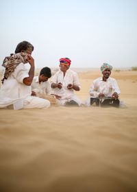 People playing music at desert