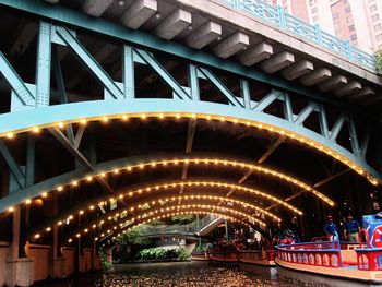 Bridge in city at night