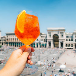 Spritz aperol drink in milan overlooking piazza duomo
