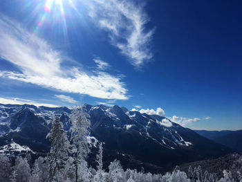 Scenic view of snowcapped mountains against sky