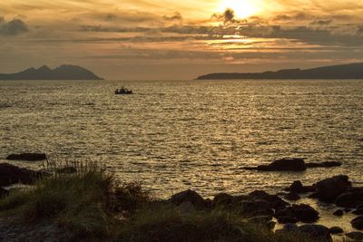 Scenic view of sea against sky during sunset