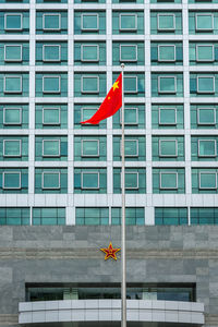 Red flag against building in city