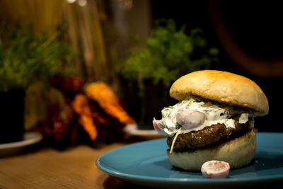 Close-up of burger in plate on table