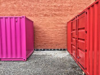 Cargo containers against wall