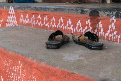 High angle view of shoes on metal