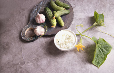 High angle view of fruits and leaves on table