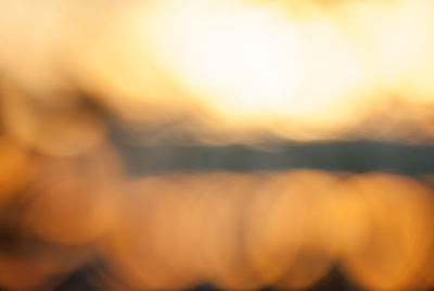 Defocused image of yellow sky during sunset