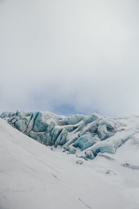 Scenic view of snow covered landscape against sky