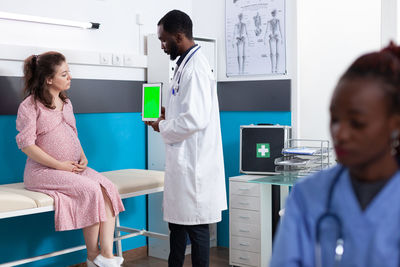 Female doctor examining chemical in laboratory