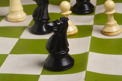 High angle view of chess pieces on table