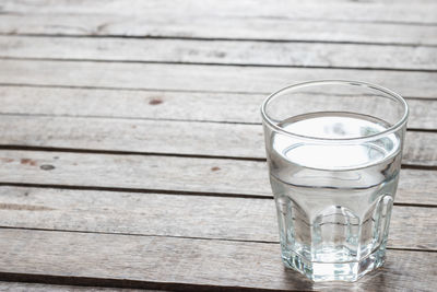 High angle view of glass of water on table