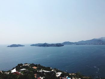 High angle view of bay against clear sky