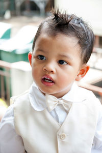 Close-up of cute boy looking away