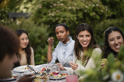 Friends toasting drinks at restaurant