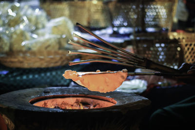 Cropped image of person preparing food