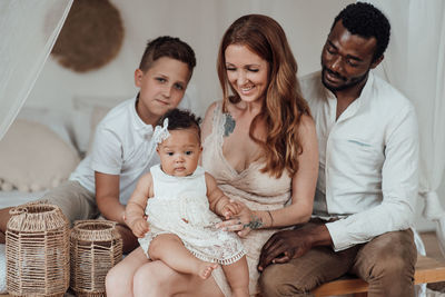 Group of two people sitting at home