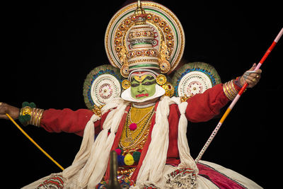 Low angle view of traditional equipment against black background