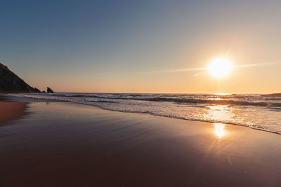 Scenic view of sea against sky at sunset