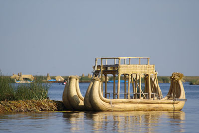 Boat in sea against clear sky