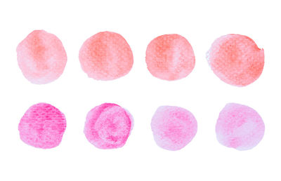 Close-up of pink eggs against white background