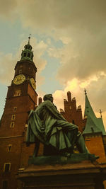Low angle view of statue against cloudy sky