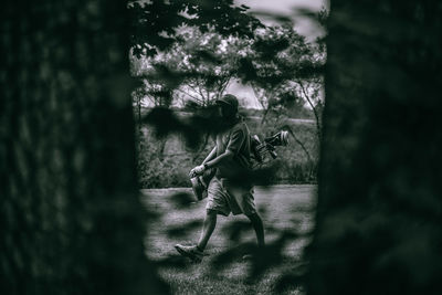 People on road amidst trees in forest