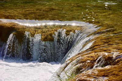 High angle view of water flowing in river