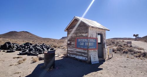 Built structure on desert land against clear sky