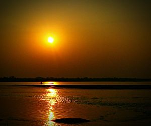 Scenic view of sea against sky at sunset