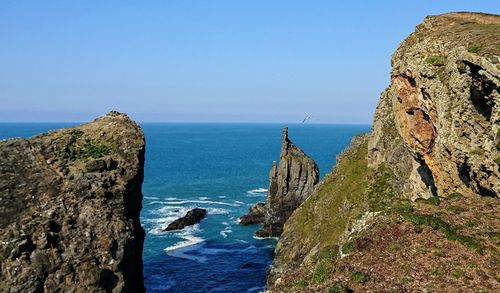 Scenic view of sea against clear blue sky