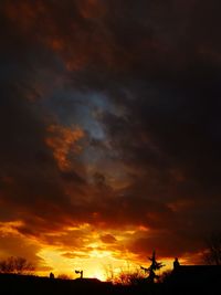 Low angle view of dramatic sky during sunset