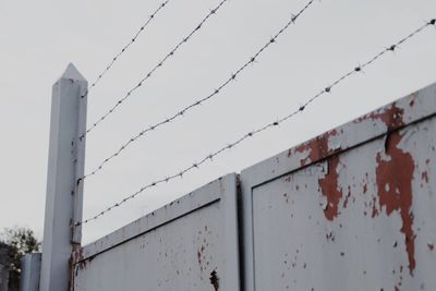 Low angle view of barbed wire