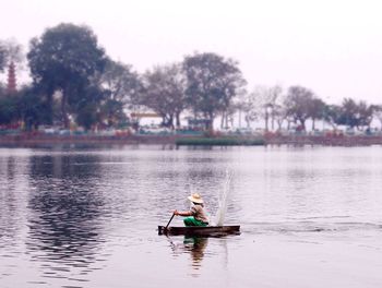 Boat sailing in lake